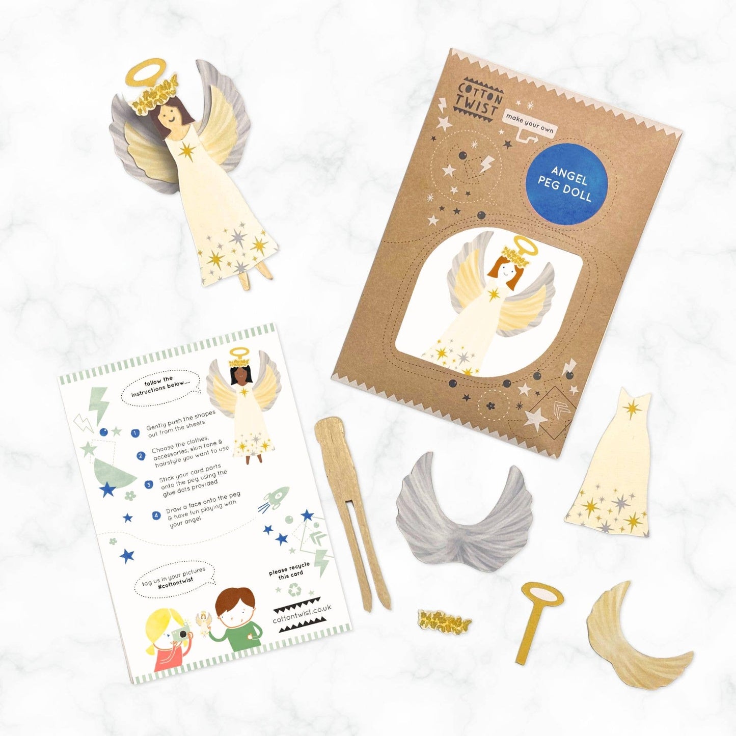 Angel peg doll kit with packaging, instructions, and materials on a white background