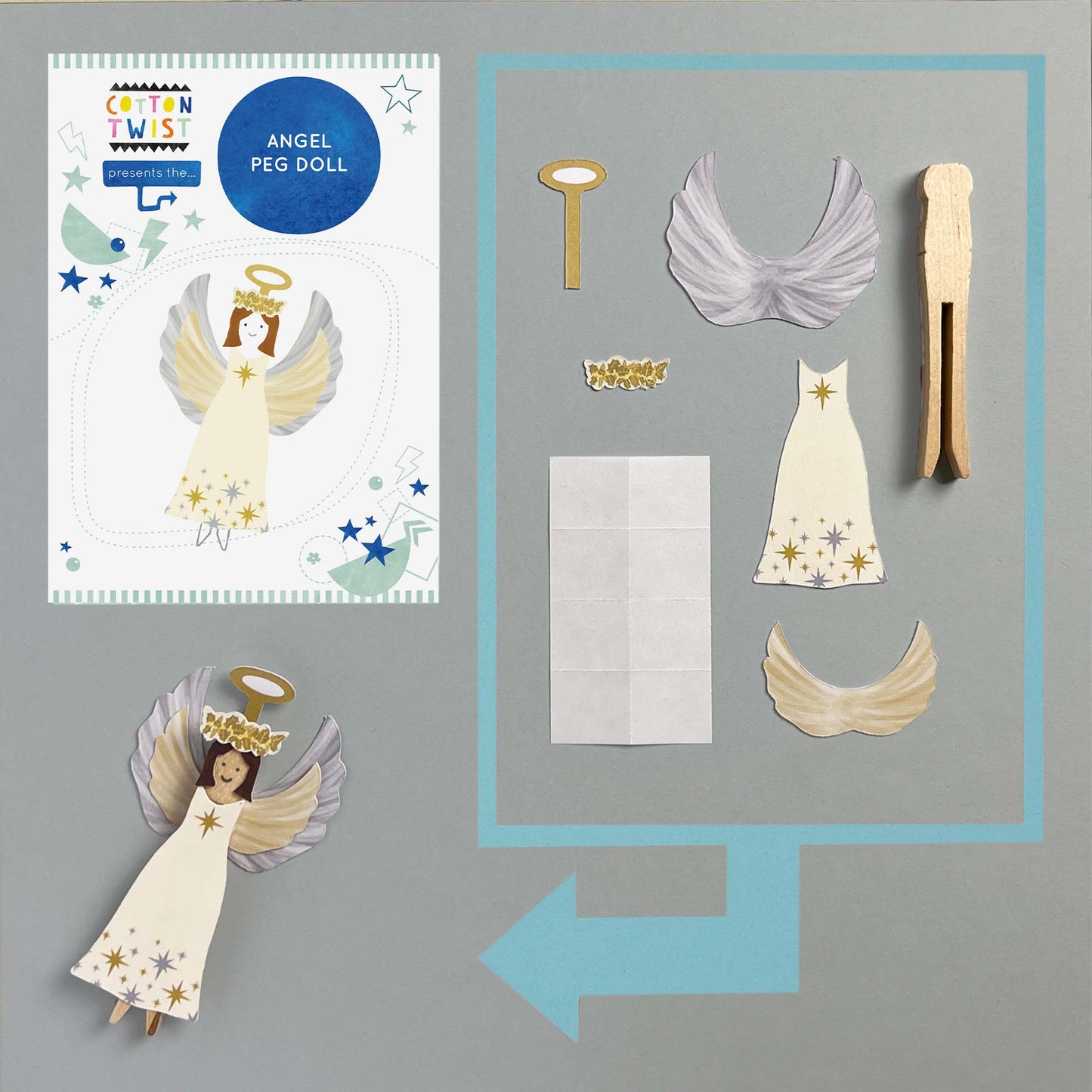 Angel peg doll set with packaging and accessories on a gray background