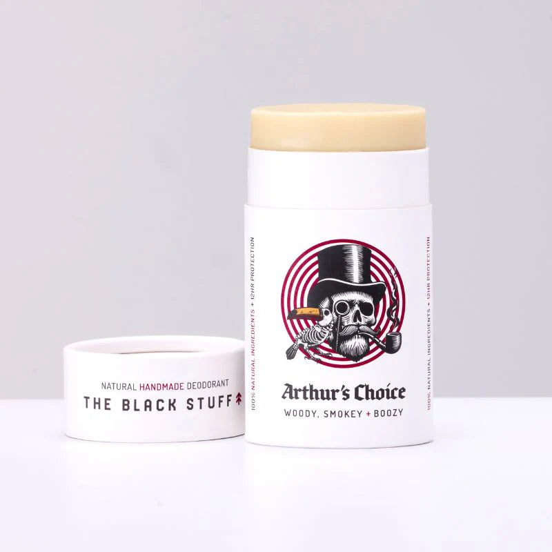 Natural deodorant container labeled 'The Black Stuff' and 'Arthur's Choice' on a light gray background.