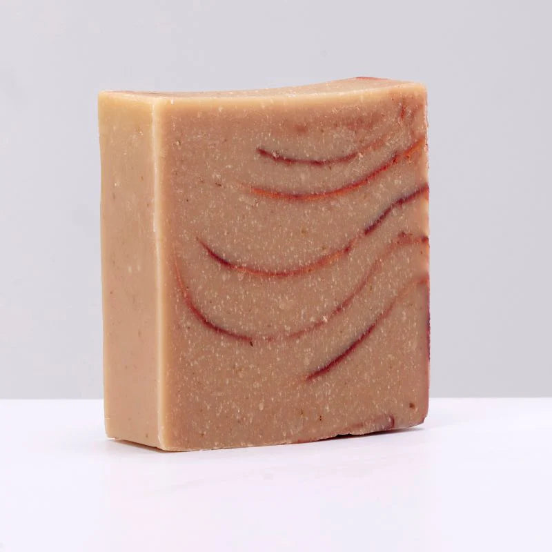 Bar of soap with a marbled pattern on a white background