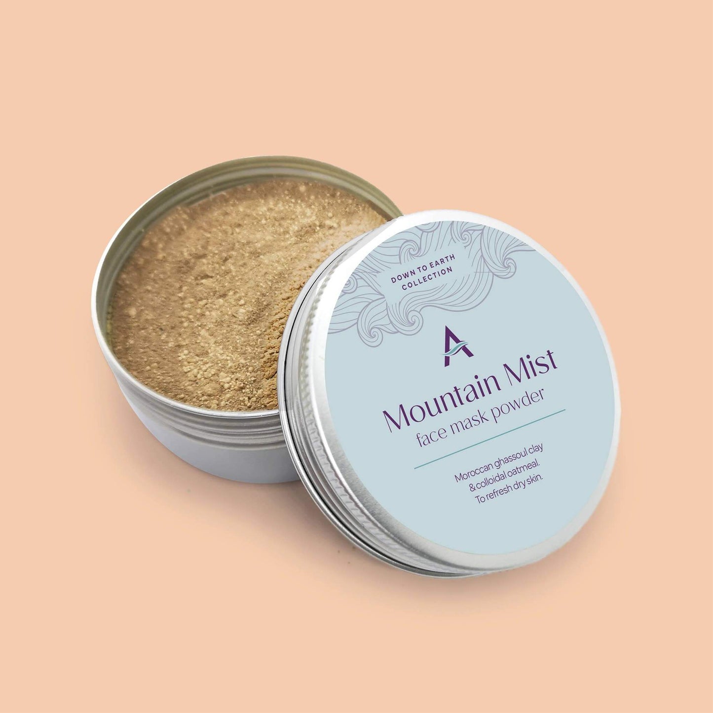A round tin container with a blue label, open lid showing the beige face mask powder inside.
