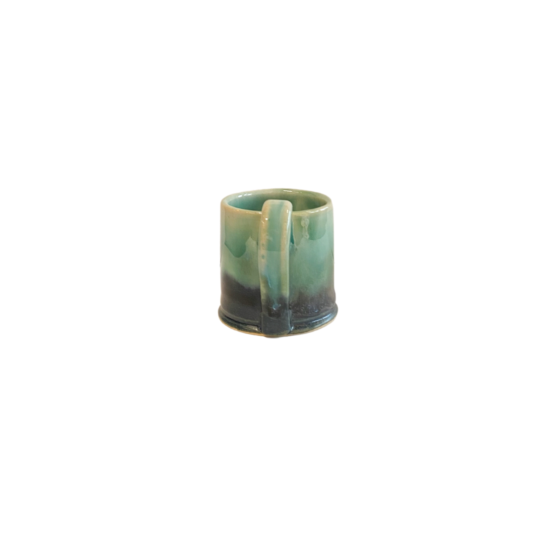 Pretty hand thrown espresso cup in green and blue glaze side view