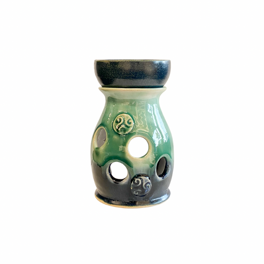 Pretty hand thrown stoneware wax burner in blue and green glaze with Celtic swirl design accents
