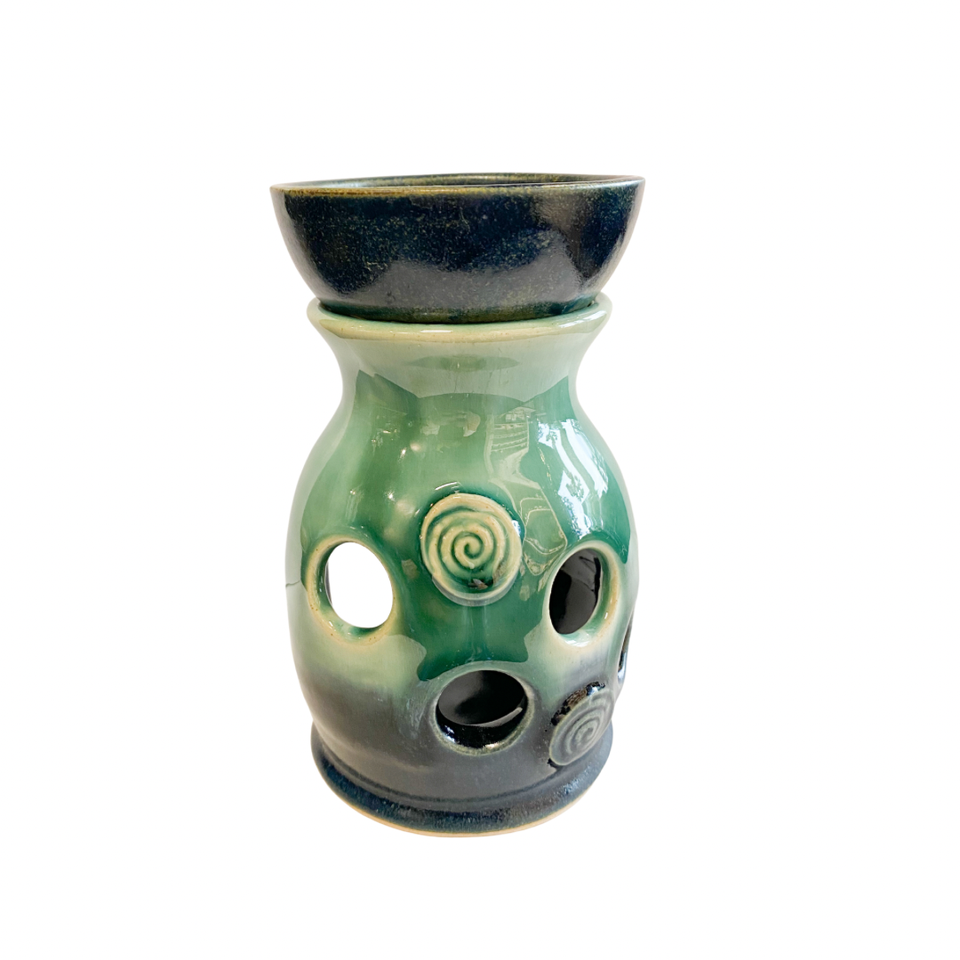 Pretty hand thrown stoneware wax burner in blue and green glaze with Celtic spiral design accents