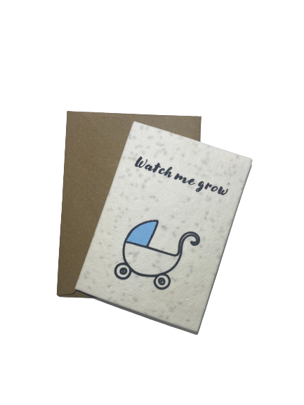 A greeting card with a baby stroller design and the text 'Watch me grow', accompanied by a recycled paper envelope.