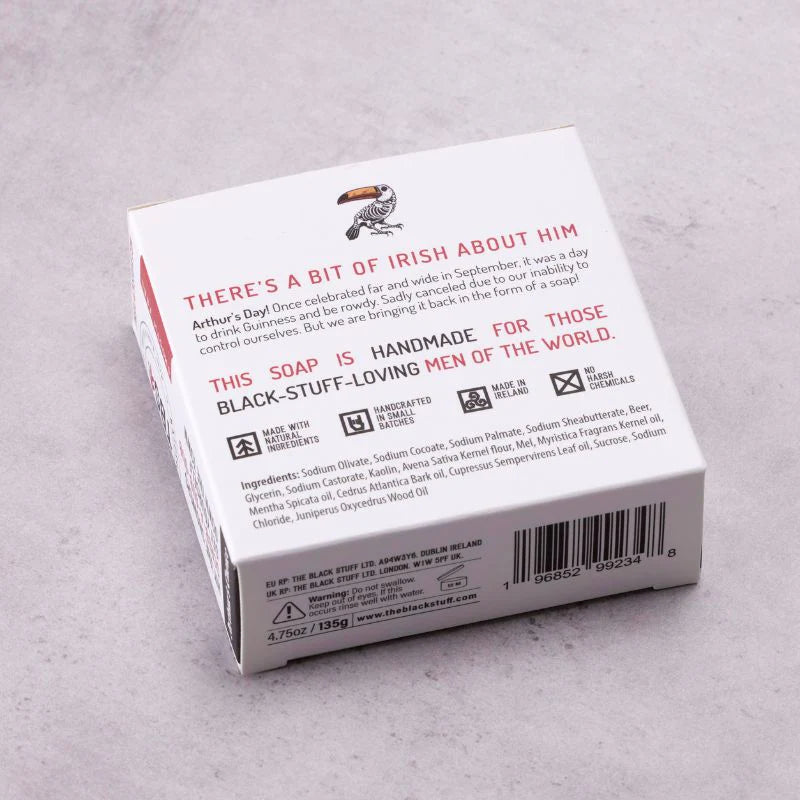 Back of a soap packaging box with text on a gray surface