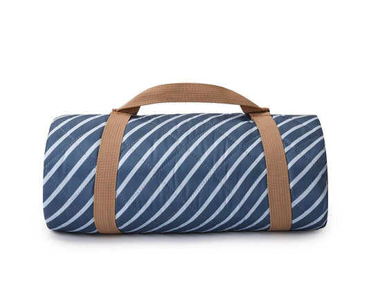 Blue and white striped padded waterproof picnic blanket with beige carrying strap