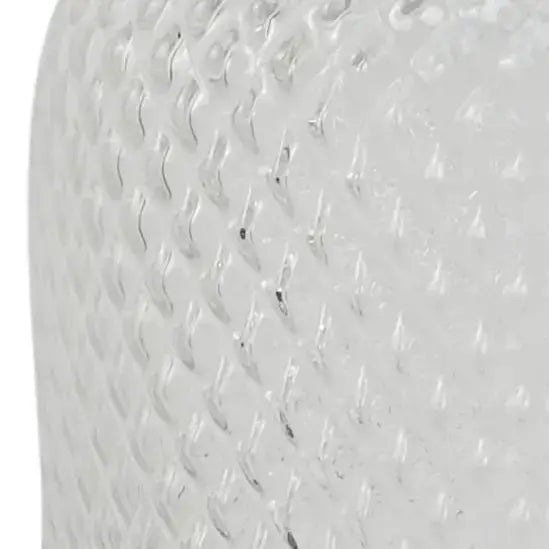 A clear glass vase. Close up of the geometric diamond pattern