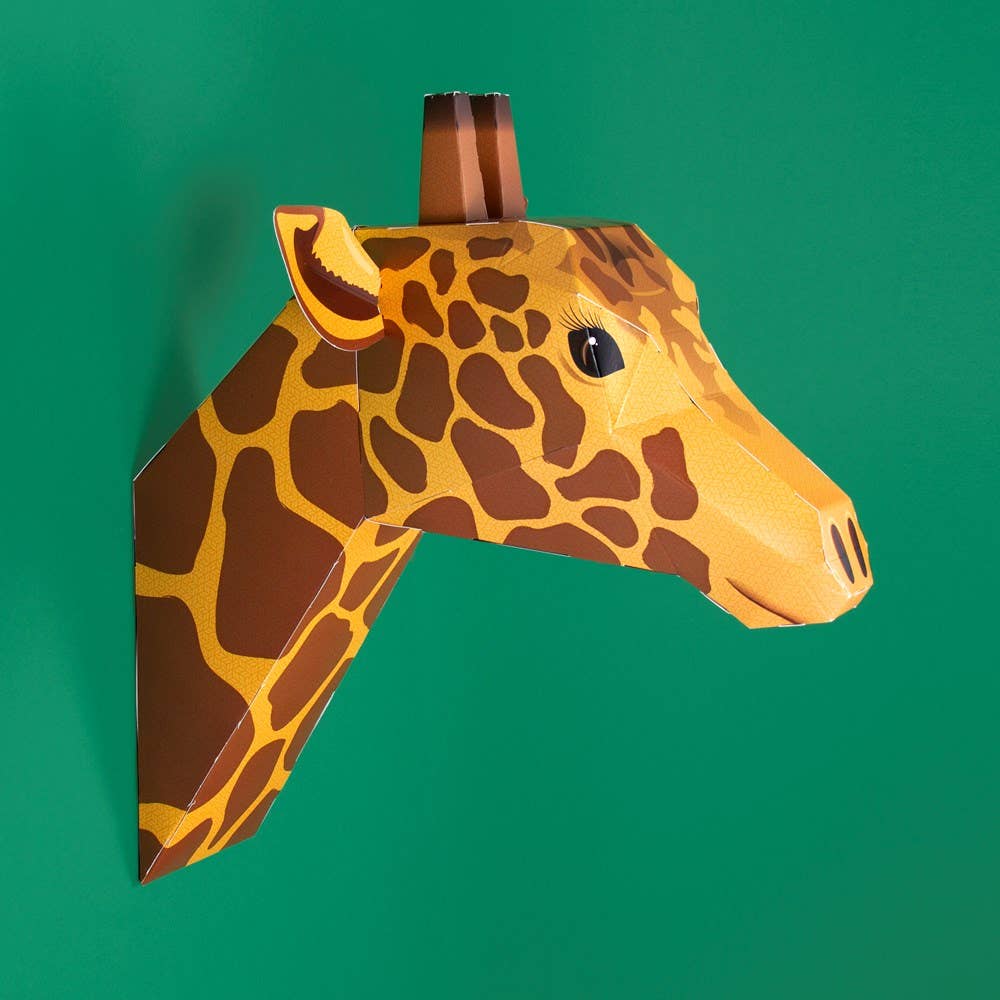 Giraffe head mask on a green background
