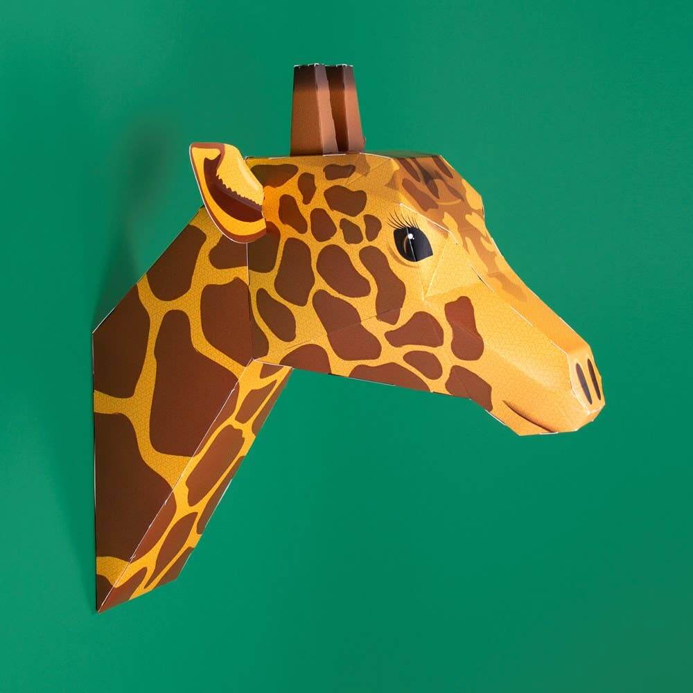 Giraffe head mask on a green background