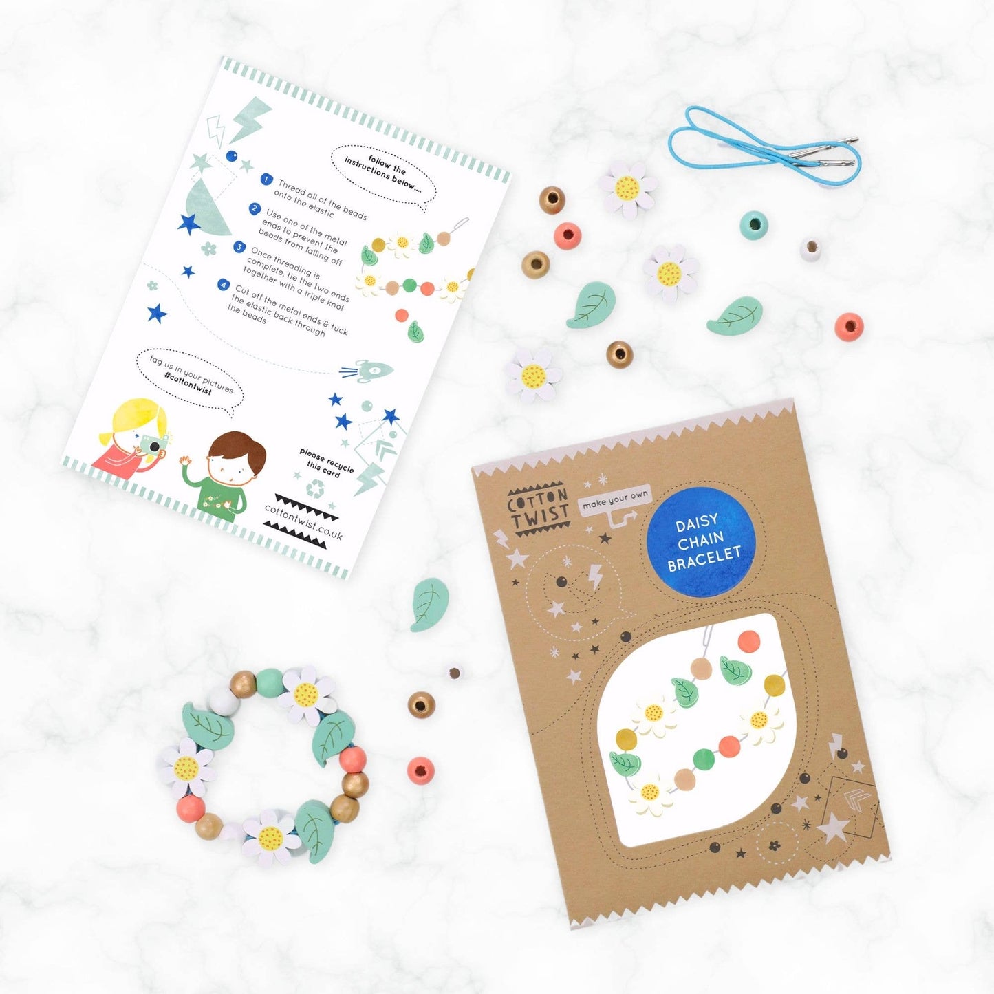 Craft kit with bracelet making materials and instructions on a white background