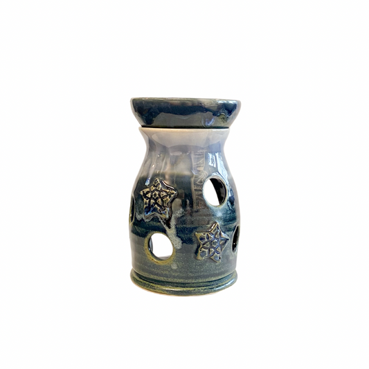 Pretty graduated blue glazed hand thrown stoneware wax burner. Embossed star patterns scattered across the surface.