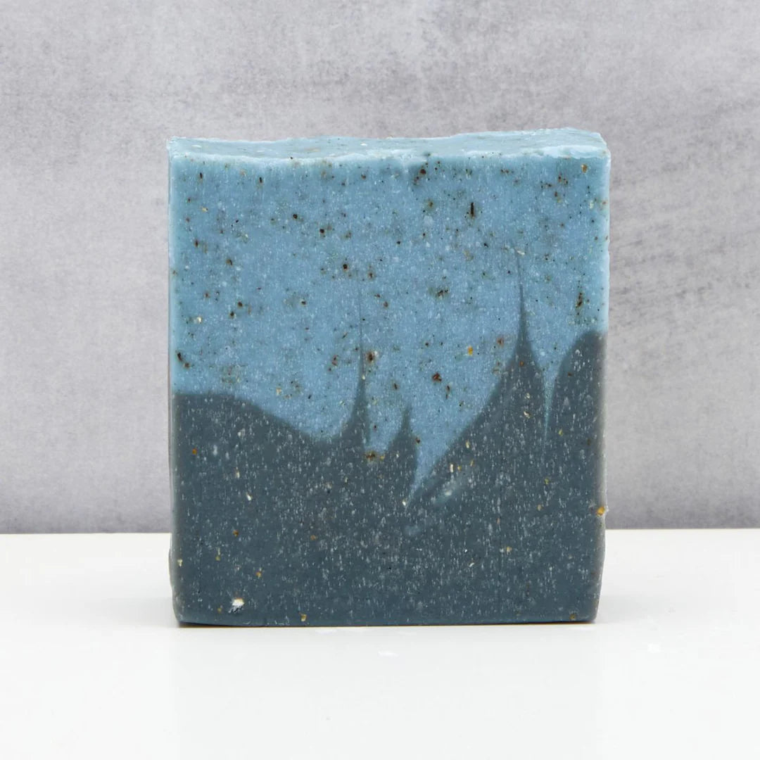 Two-tone blue and gray soap bar on a gray background