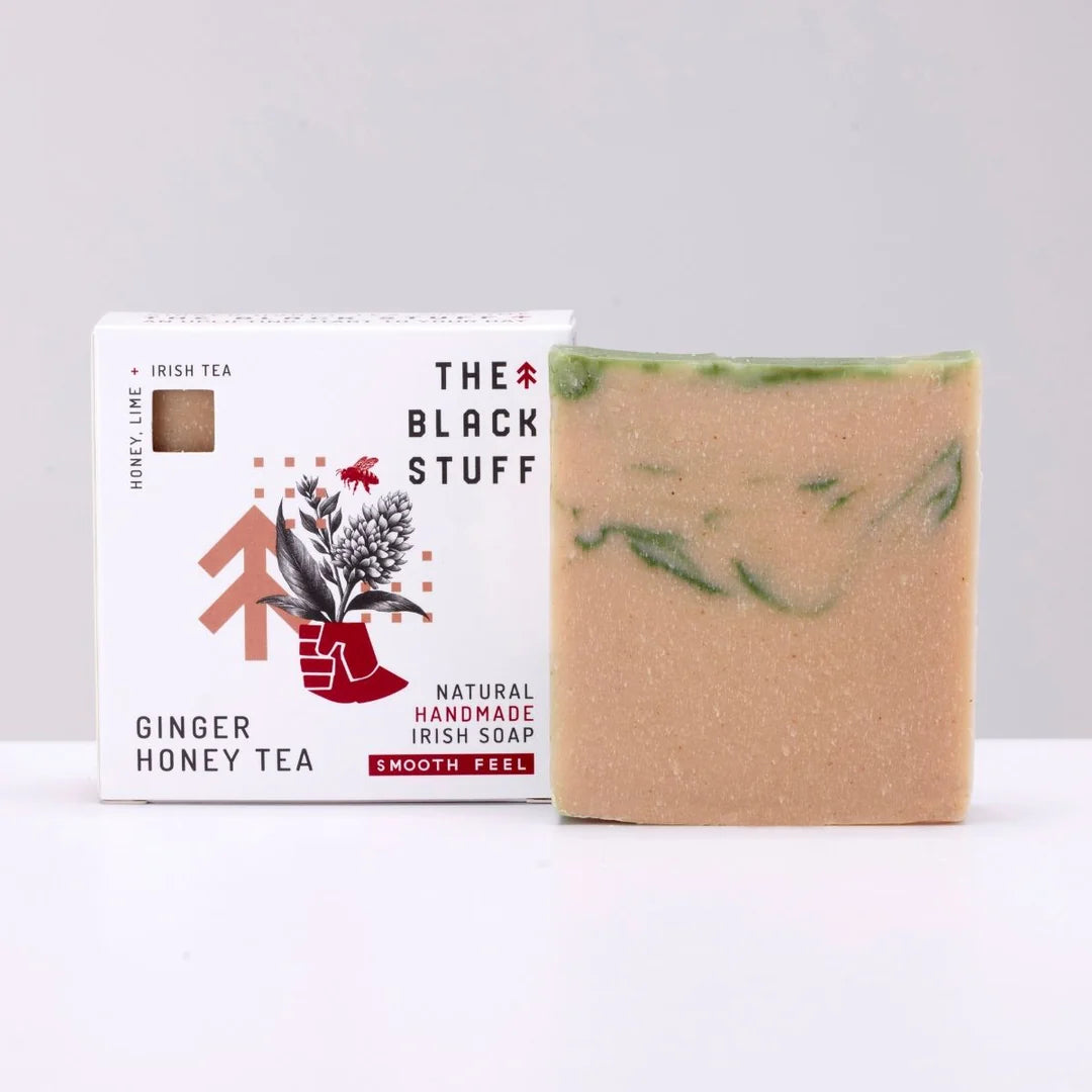 Bar of soap with 'The Black Stuff' packaging on a white background
