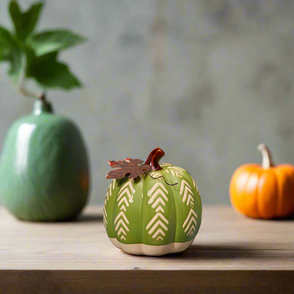 Pretty green ceramic pumpkin with chevron design and rustic metal leaf