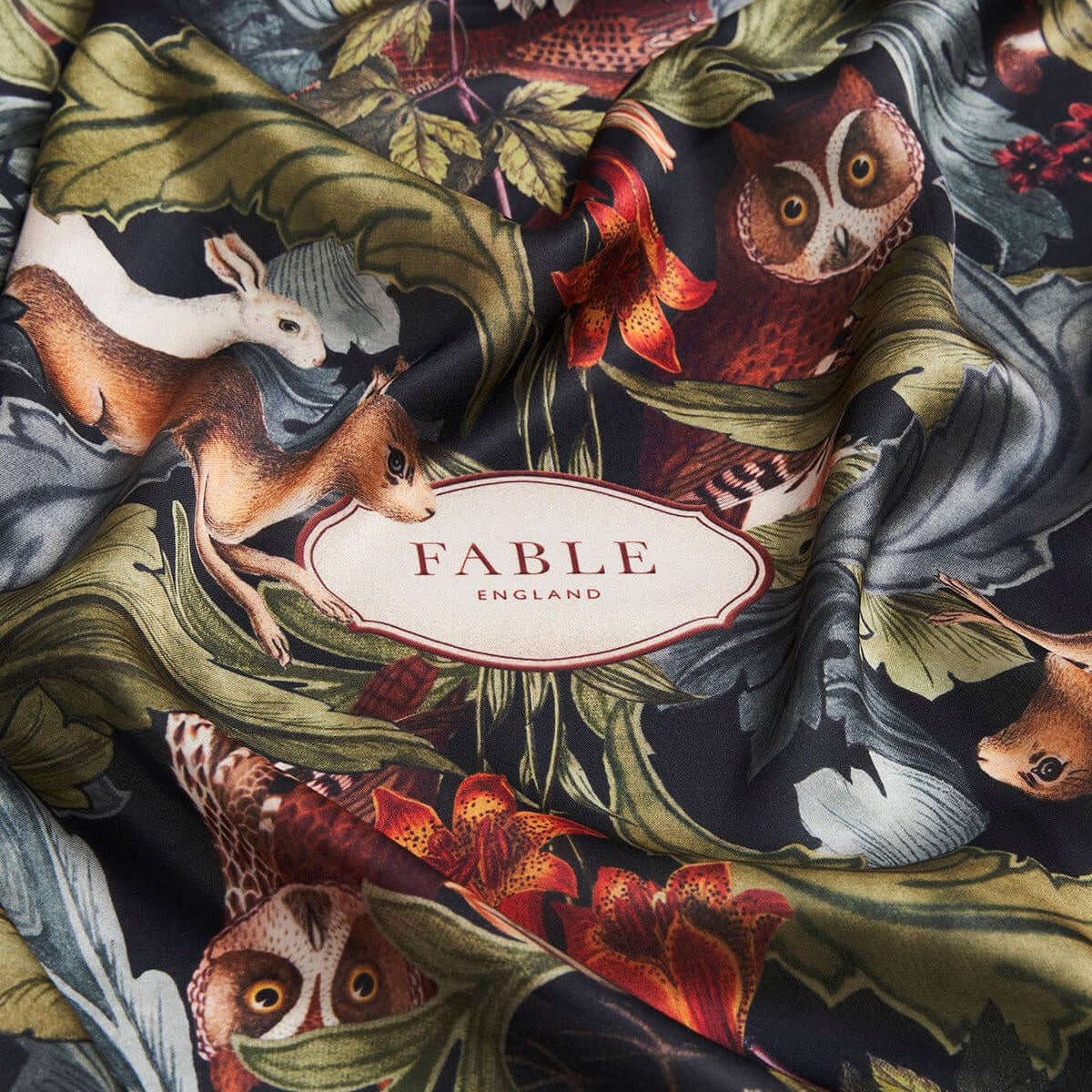 Fable England fabric with animal and floral pattern