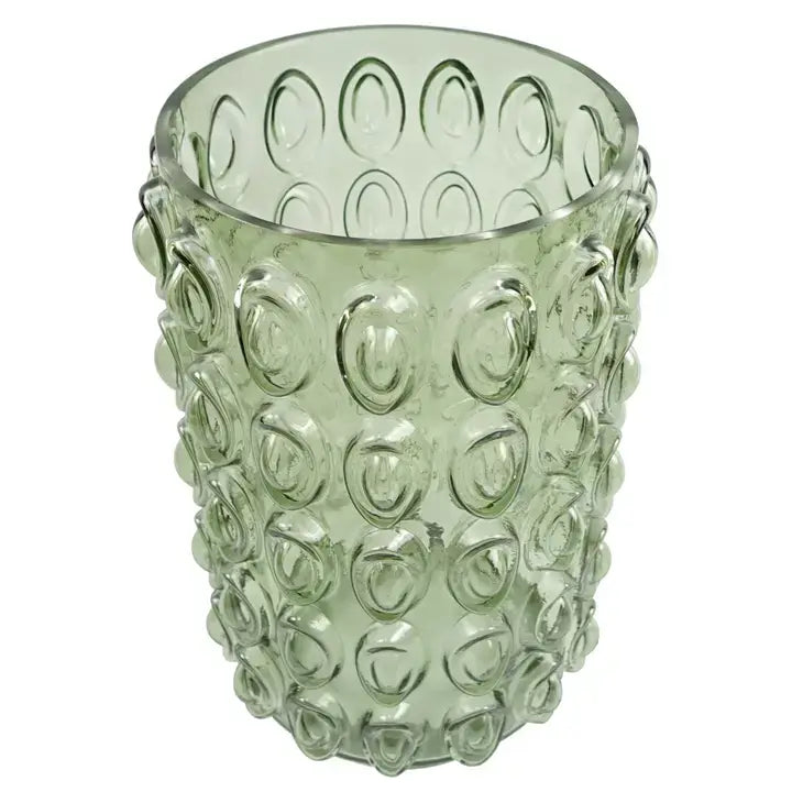 A green retro style glass vase with an embossed bubble pattern from overhead view