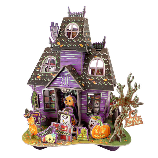 Halloween-themed toy house with pumpkins and ghosts on a white background