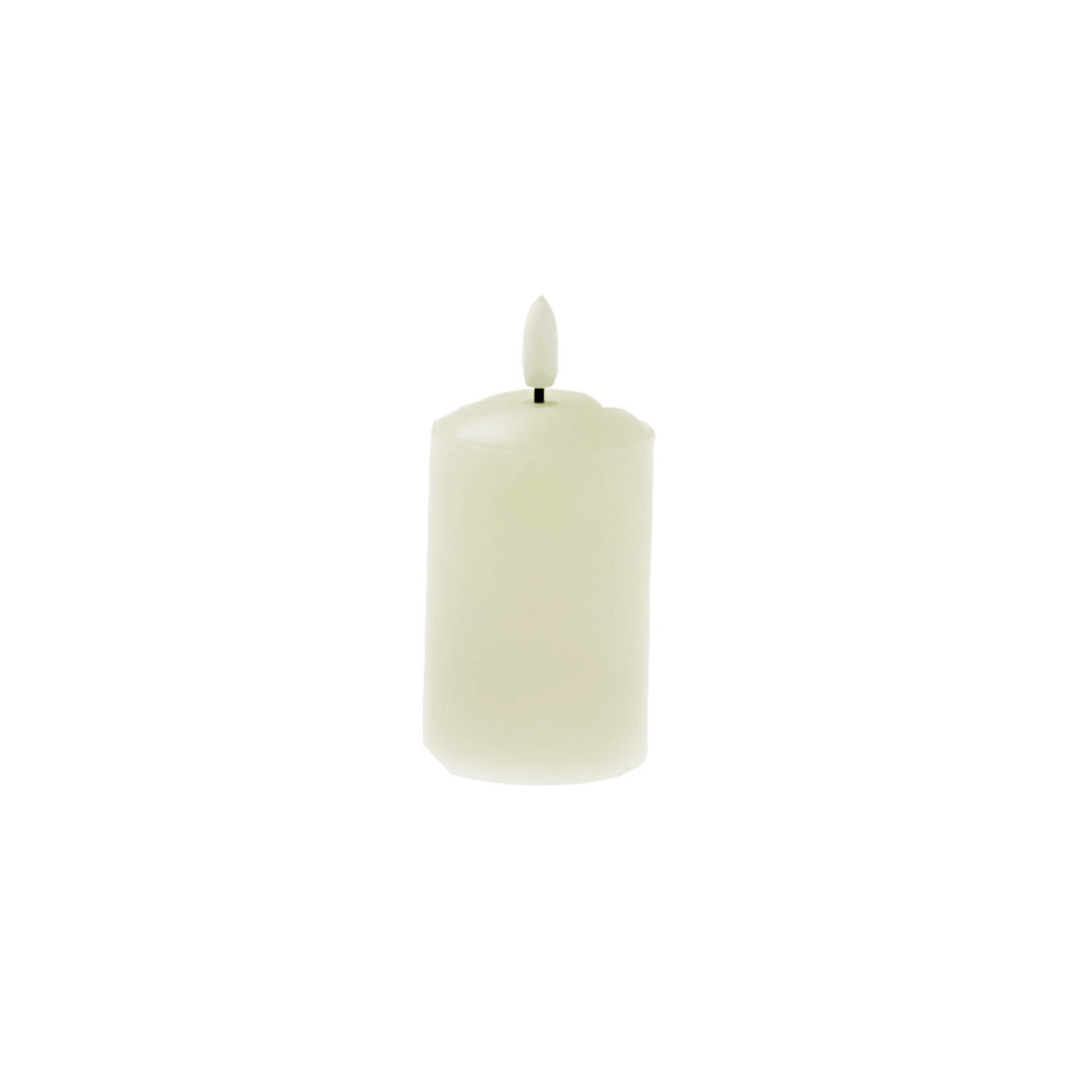 Flameless Ivory wax candle on white background. LED battery operated