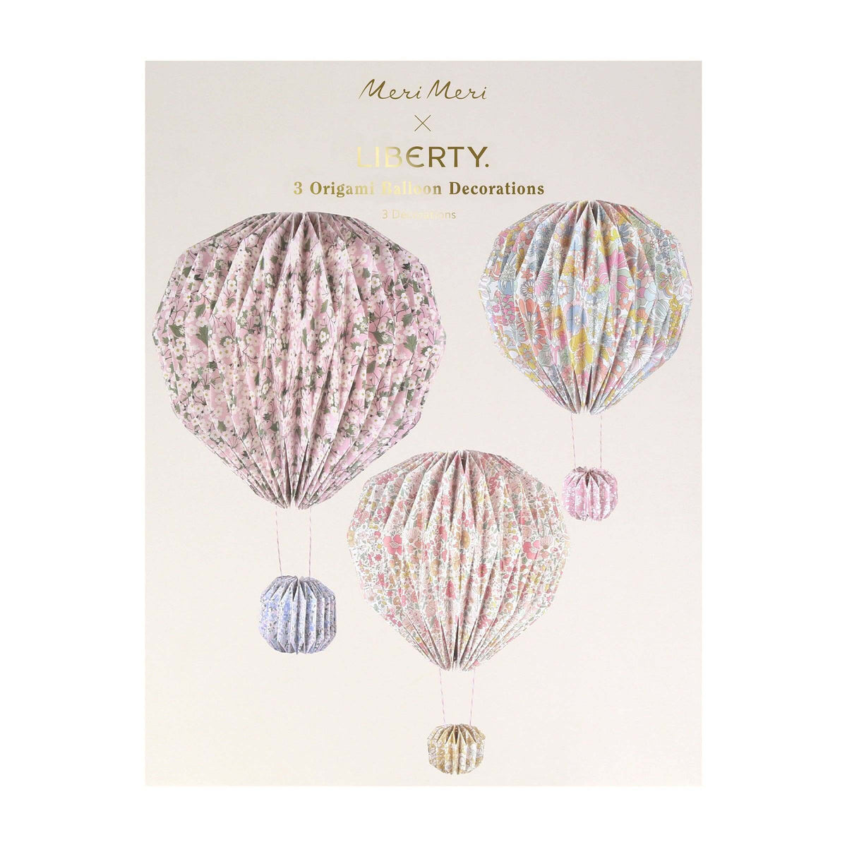 Decorative hot air balloons with floral patterns on a beige background, featuring Meri Meri and Liberty branding.