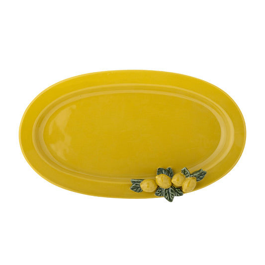 Yellow ceramic platter with decorative lemons and leaves on a white background