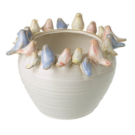 Ceramic bowl with decorative birds on a white background