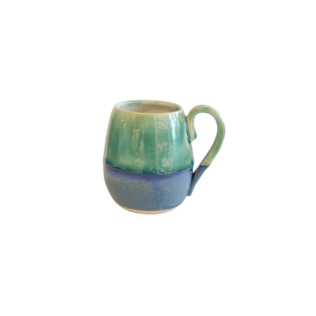 Pretty hand made curved flat white mug in blue and green glaze.