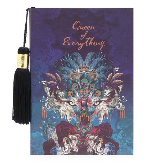 Decorative notebook with plumage and cats eye decoration plus a tassel on a white background