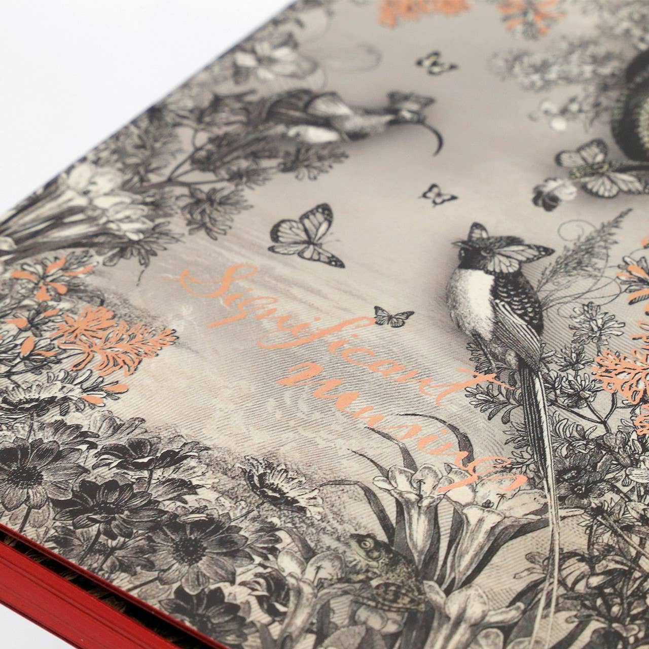 Decorative notebook with floral and bird pattern and 'Significant Moments' text.