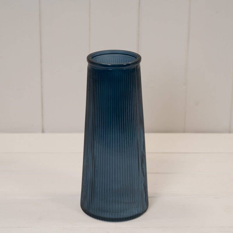 Tall Blue ribbed glass vase. Tapered at the top