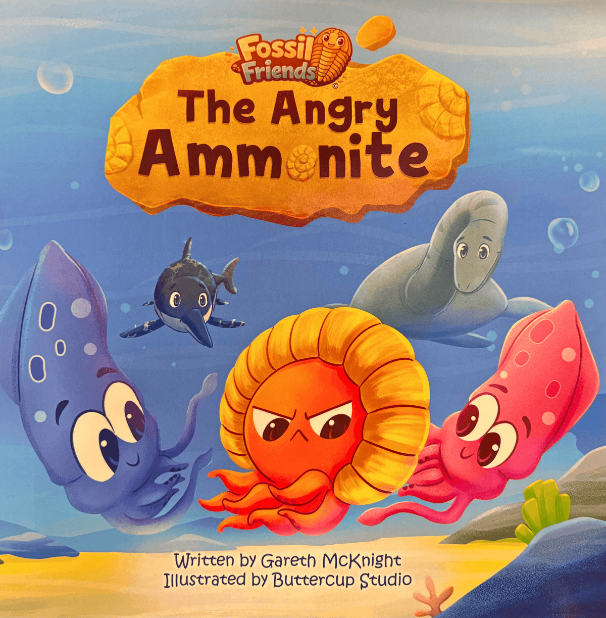 The Angry Ammonite game in colourful packaging with a cartoon ammonite