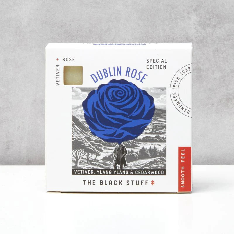 The Black Stuff Dublin Rose.Soap packaging with blue rose design on a gray background