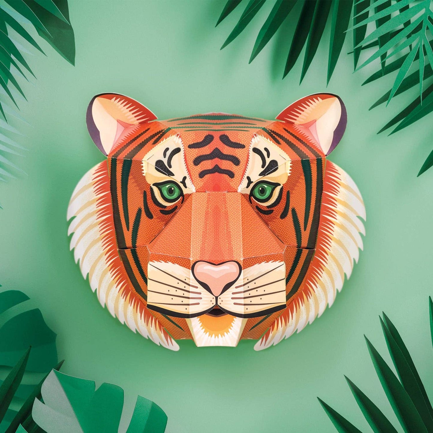 3D paper tiger model on a green background with leaf decorations