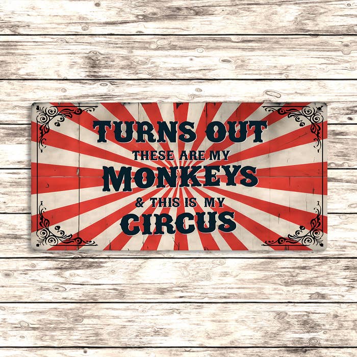 Decorative sign with text 'Turns out these are my monkeys & this is my circus' on a wooden background