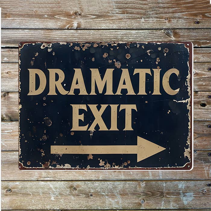 Vintage-style sign with 'Dramatic Exit' text on a wooden background