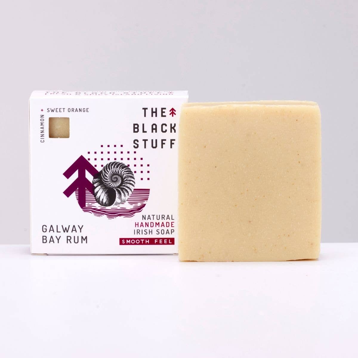 Image of The Black Stuff Natural Soap Galway Bay Rum scent sitting on a shelf beside its box