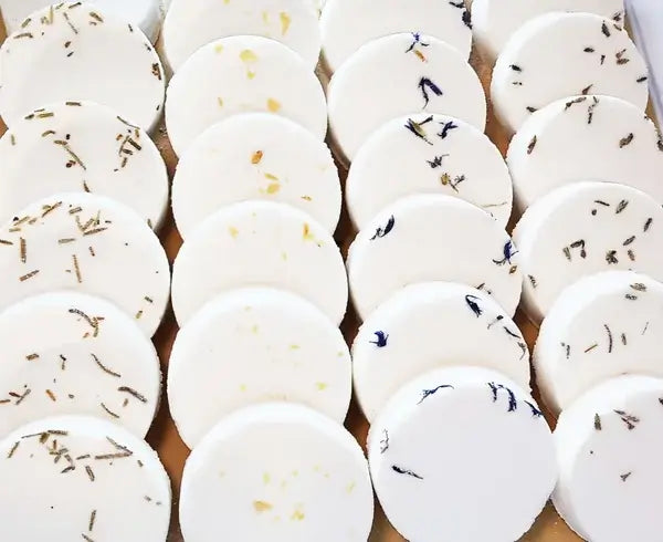 Group of white aromatherapy shower steamers shown together