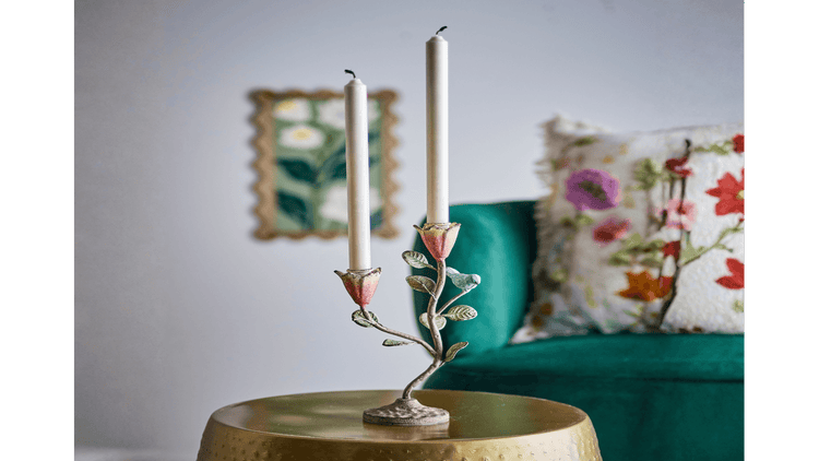 Taper candles in a decorative double candle holder