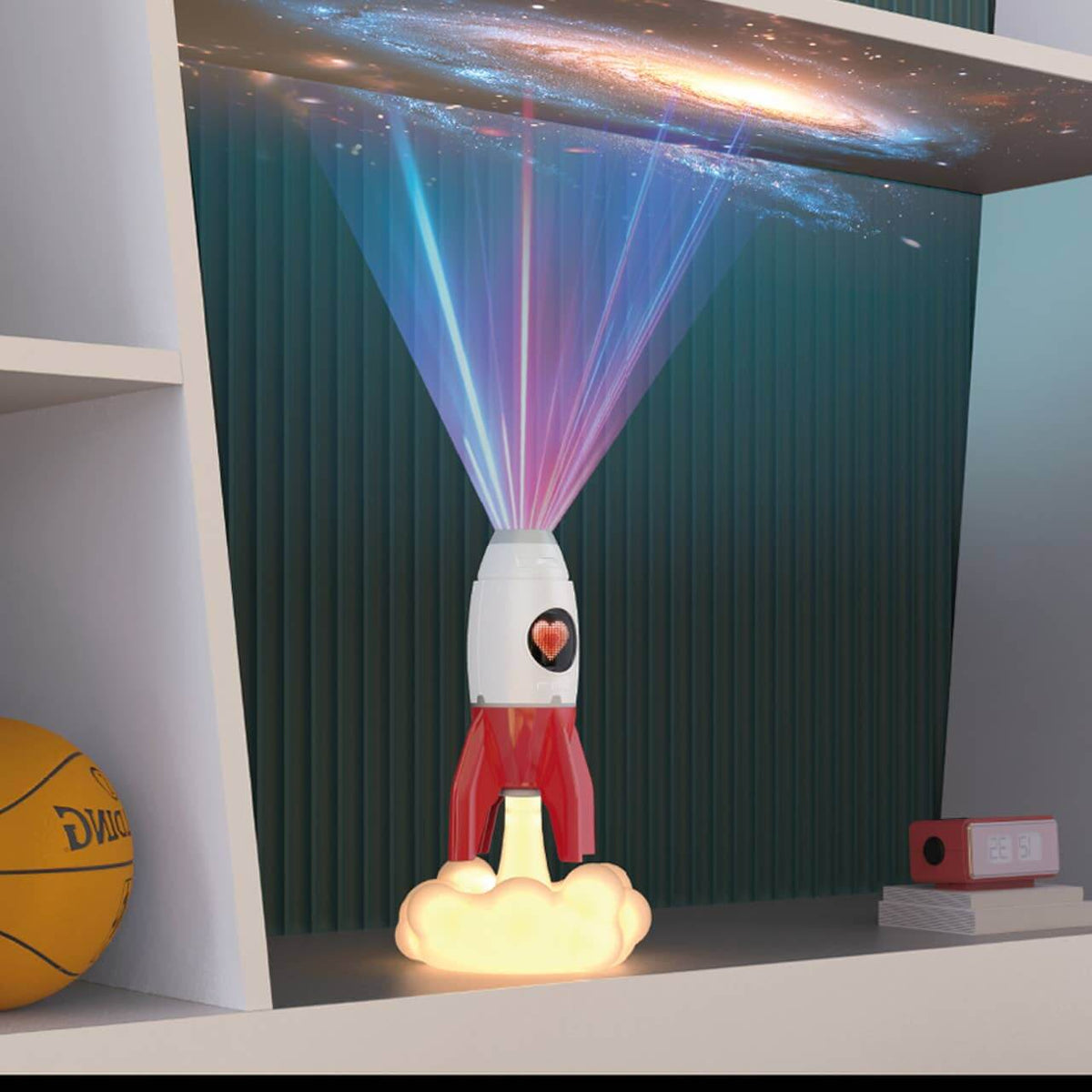 Rocket projector bedside light casting colourful beams across a bedroom