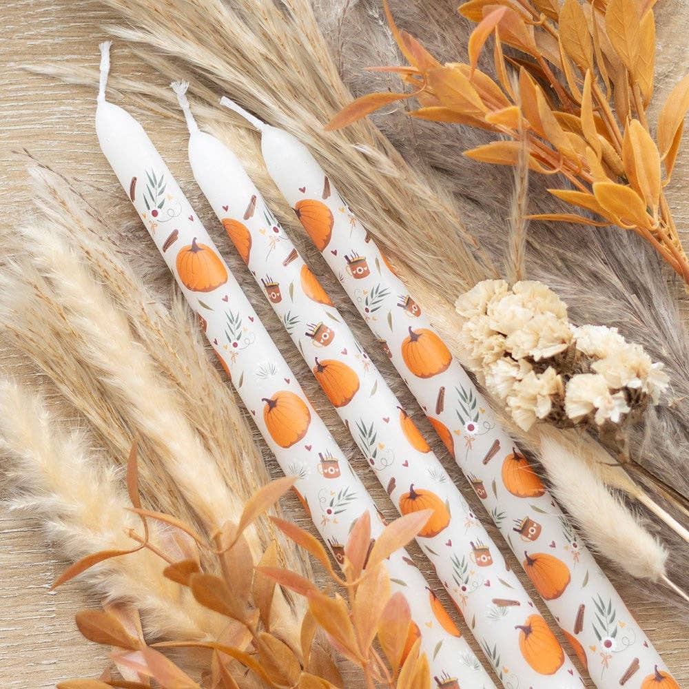 Set of 3 Autumn pumpkin patterned taper candles in an Autumnal background