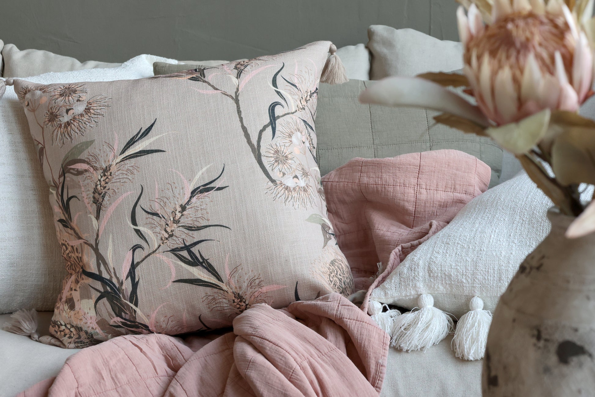 Dusky pink taupe quilt on a sofa