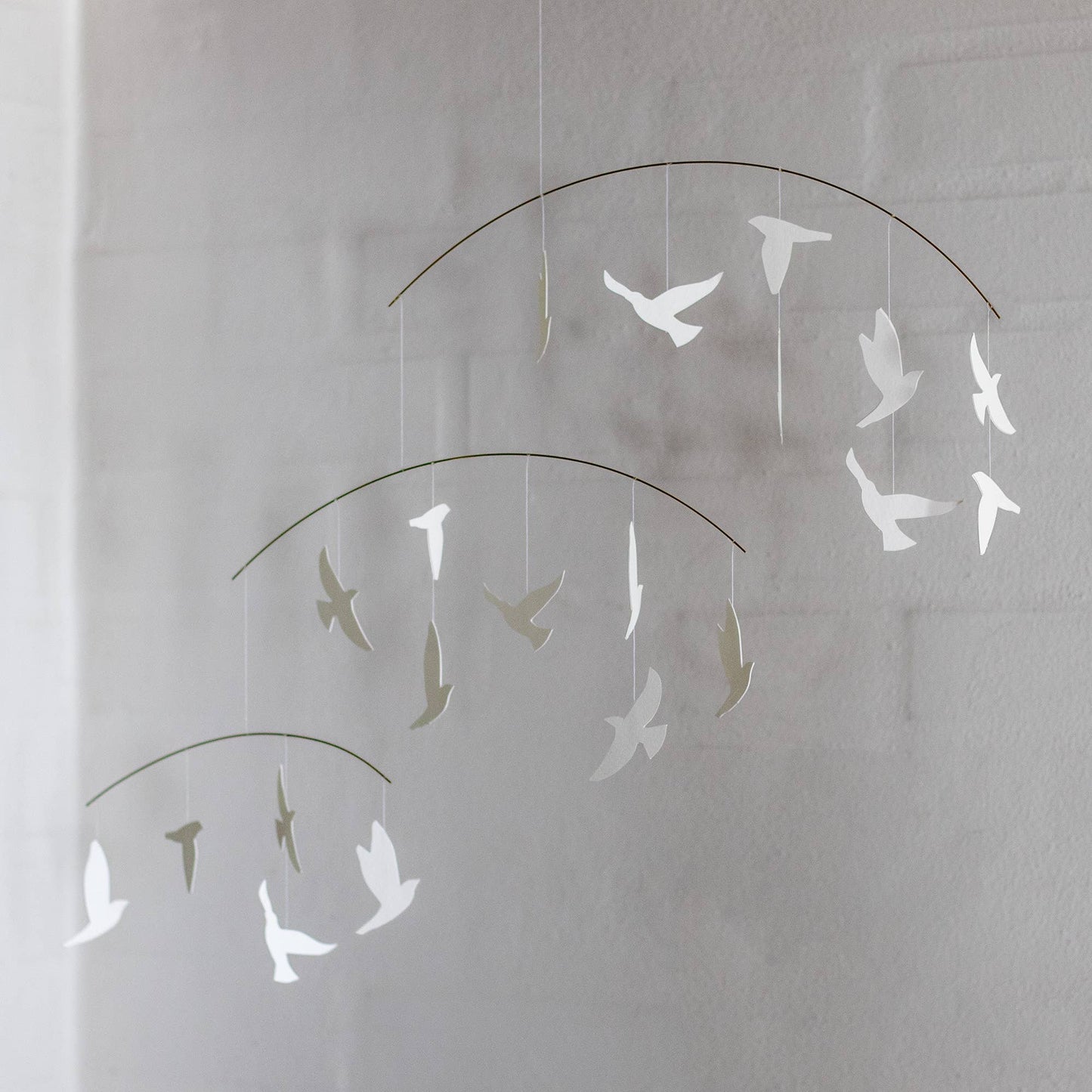 Decorative hanging wall art of white birds 