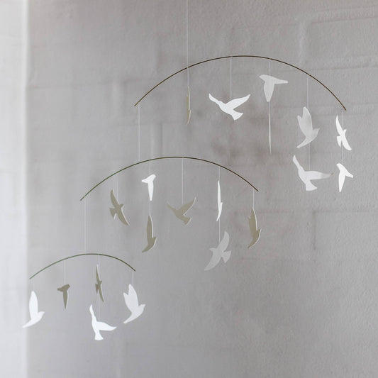 Decorative hanging wall art of white birds 