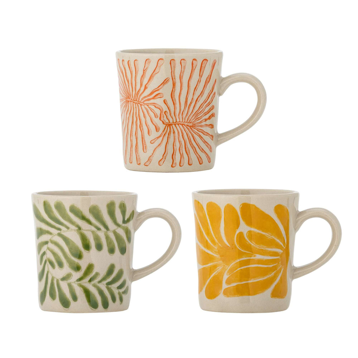 Three ceramic mugs with leaf patterns in orange, green, and yellow on a white background