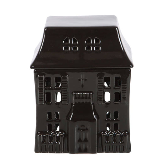 Ceramic black gothic house wax or oil burner. Front view with roof lid on 