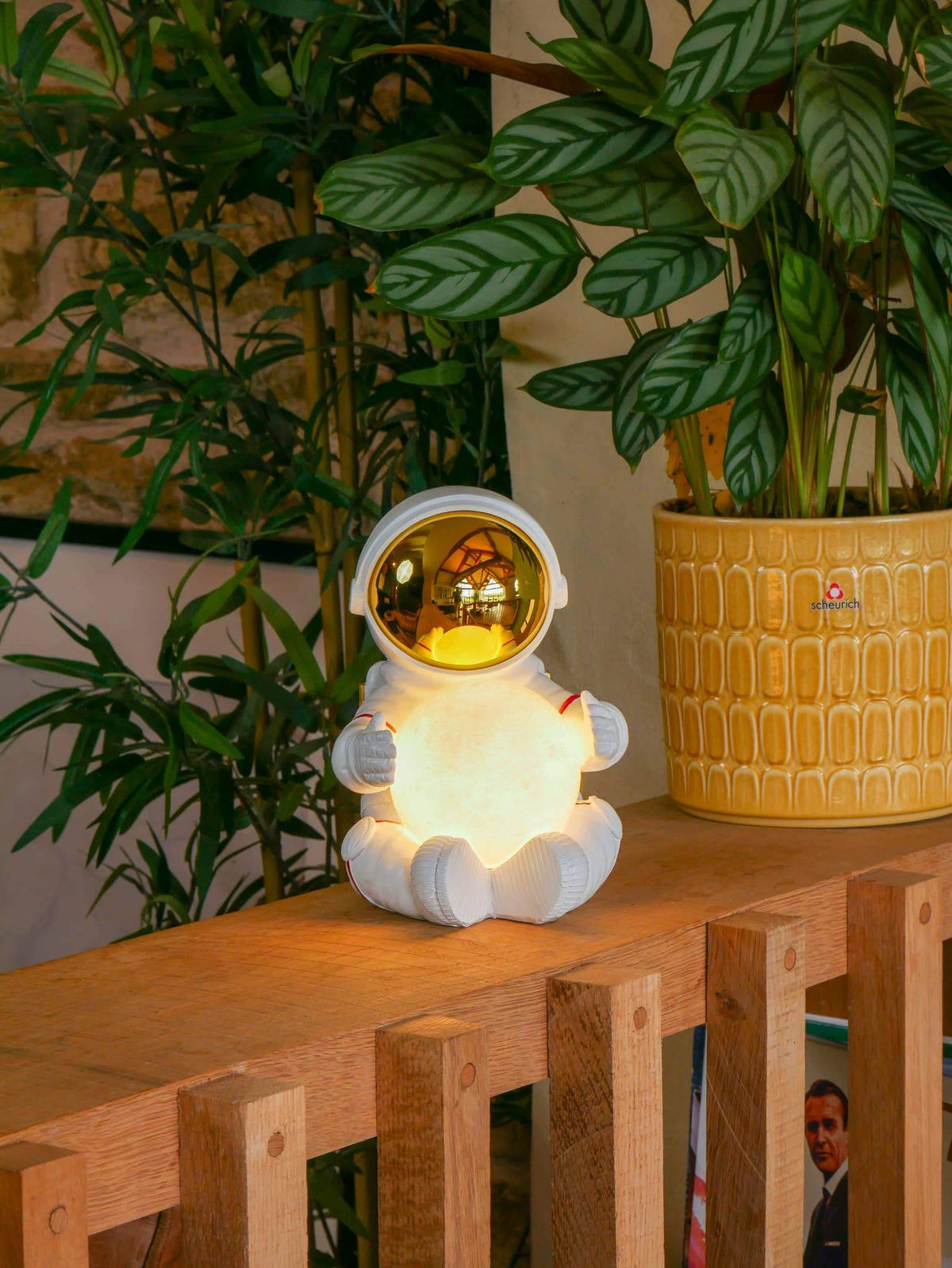 Close view of the astronaut bedside light on a wooden shelf