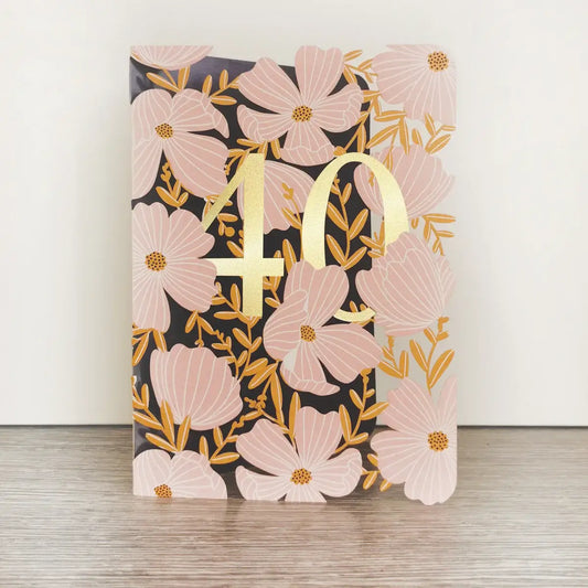 Greeting card with intricate laser-cut flower details and gold foil embellishments. The number '40' is prominently displayed in gold, indicating a 40th birthday