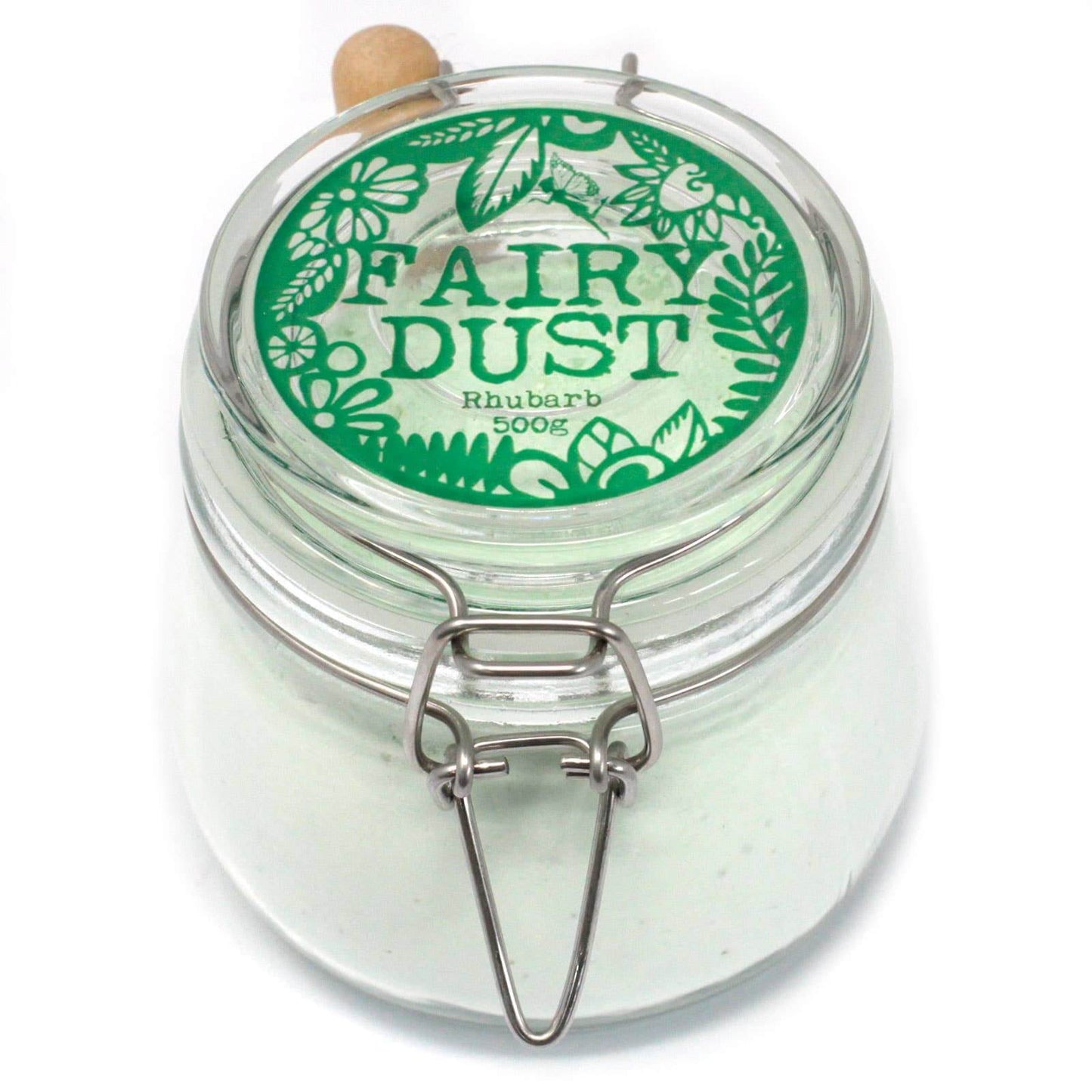 A clear glass Kilner jar with a green floral pattern label on the lid, containing a white powder labeled 'Fairy Dust Rhubarb 500g'.