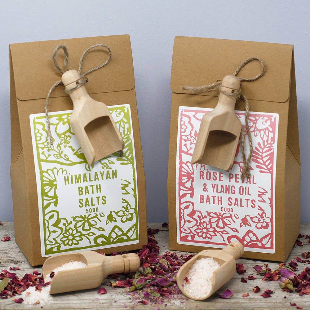Agnes + Cat Lavender Himalayan bath salts and rose petal bath salts in eco-friendly packaging with wooden scoops.