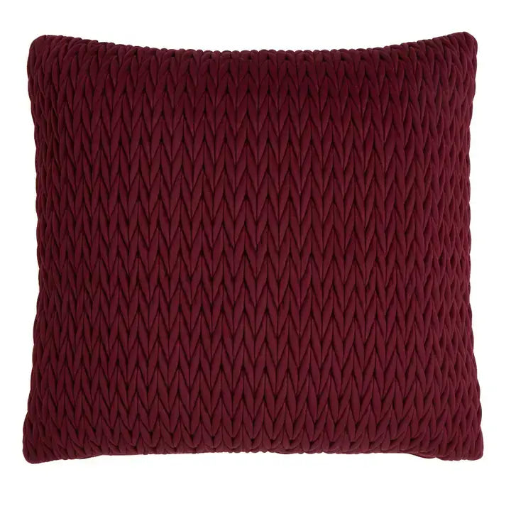 A square throw pillow in a deep burgundy color with a prominent raised chevron or wavy knit texture, shown against a plain white background.